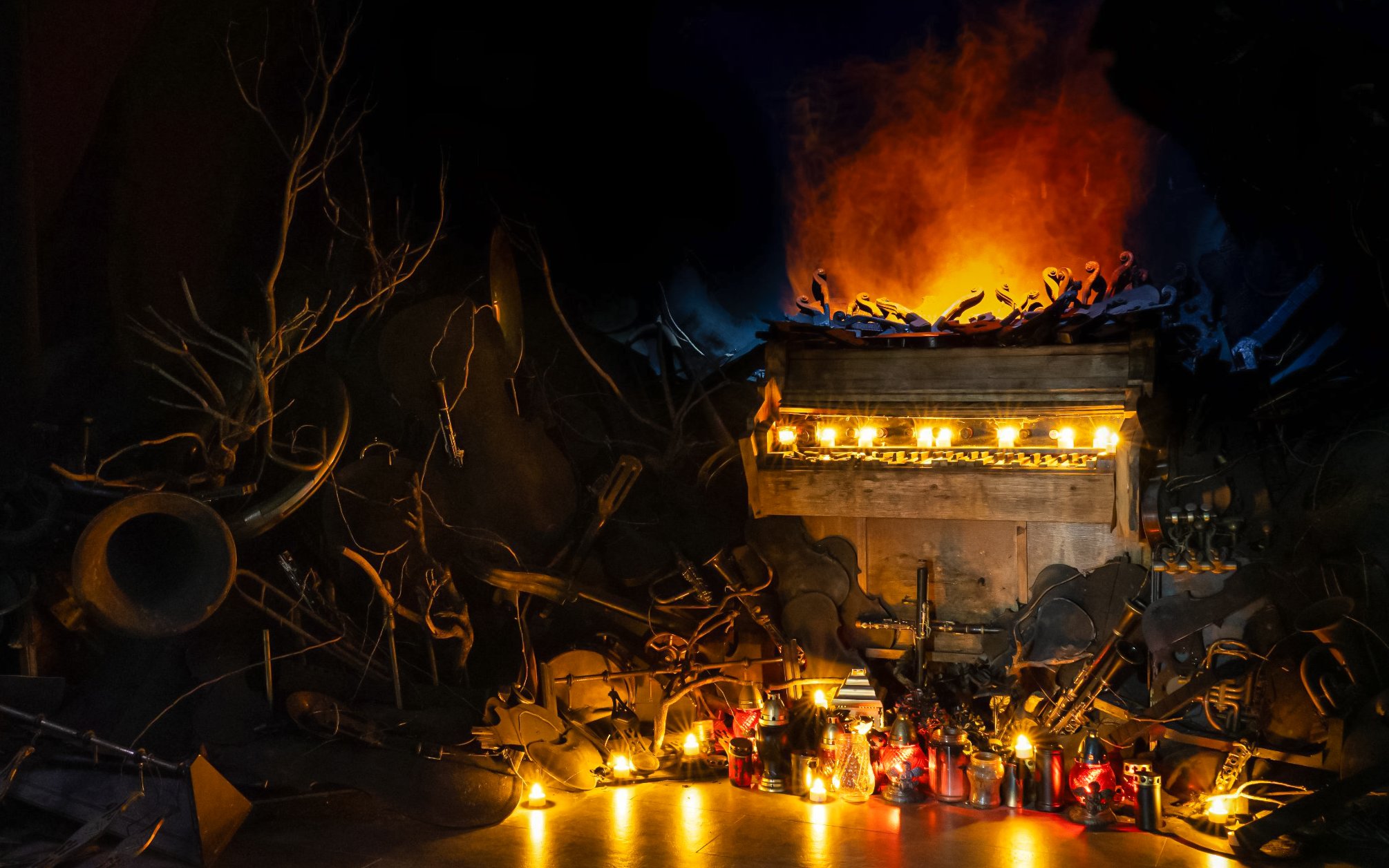 Mozart Interactive Museum exhibit with illuminated piano and instruments in Prague.