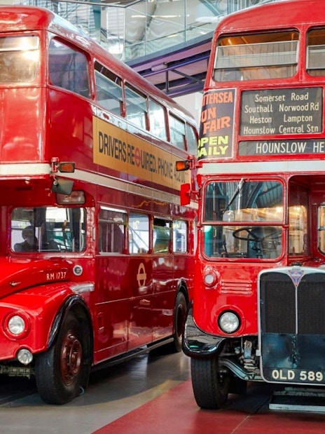 Vintage red double-decker buses on display at the London Transport Museum.