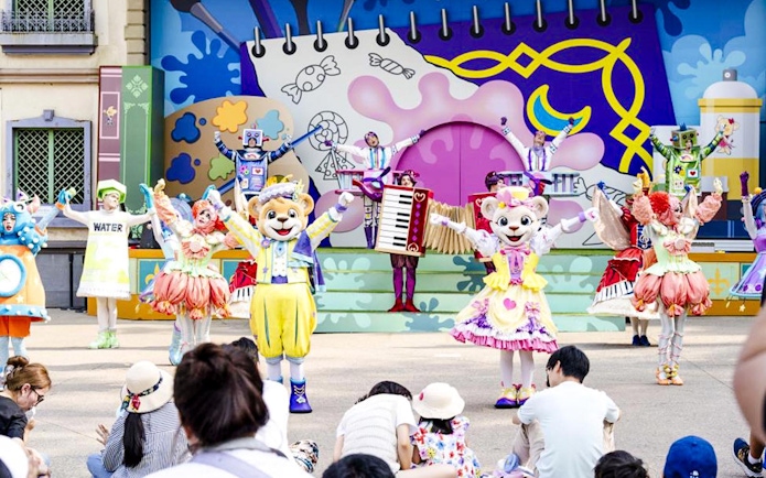 Colorful character performance at Everland theme park show.