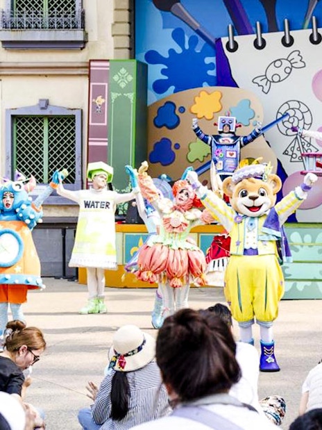 Colorful character performance at Everland theme park show.