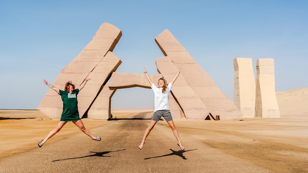 Girls jumping near the Gate of Allah in Ras Mohammed National Park, Egypt.