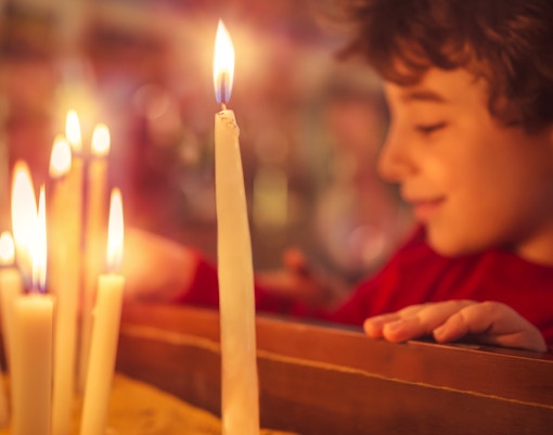 Candles lit during Christmas service at Canterbury Cathedral.