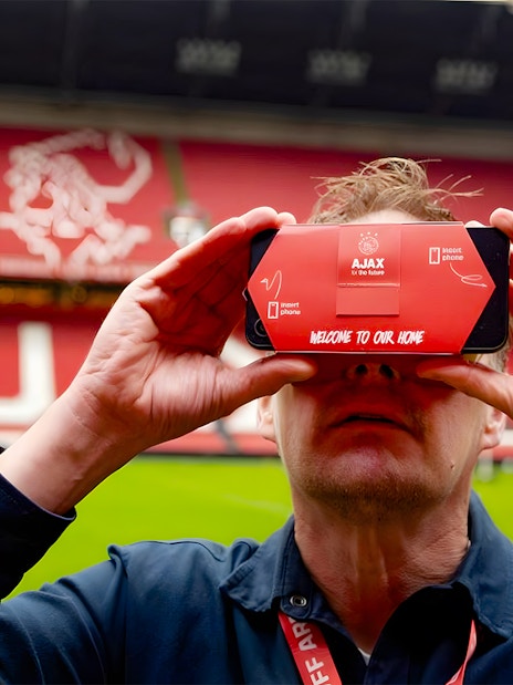 Visitor using VR headset at Johan Cruijff ArenA during Classic Tour in Amsterdam.