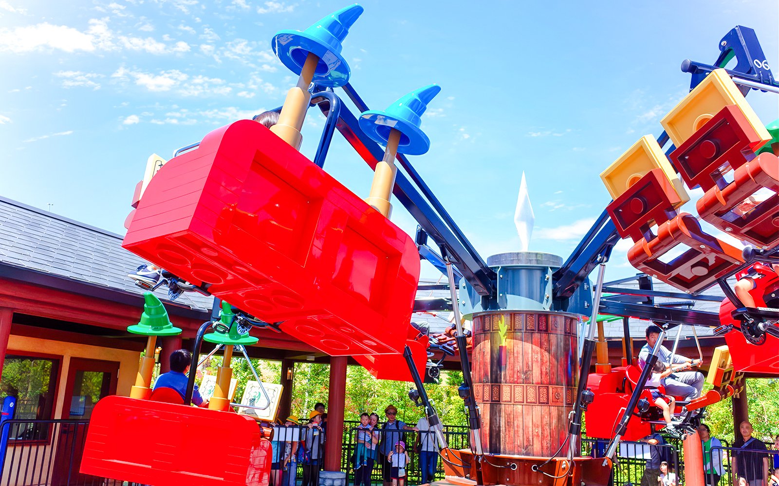 Visitors enjoying a colorful ride at Legoland Japan.