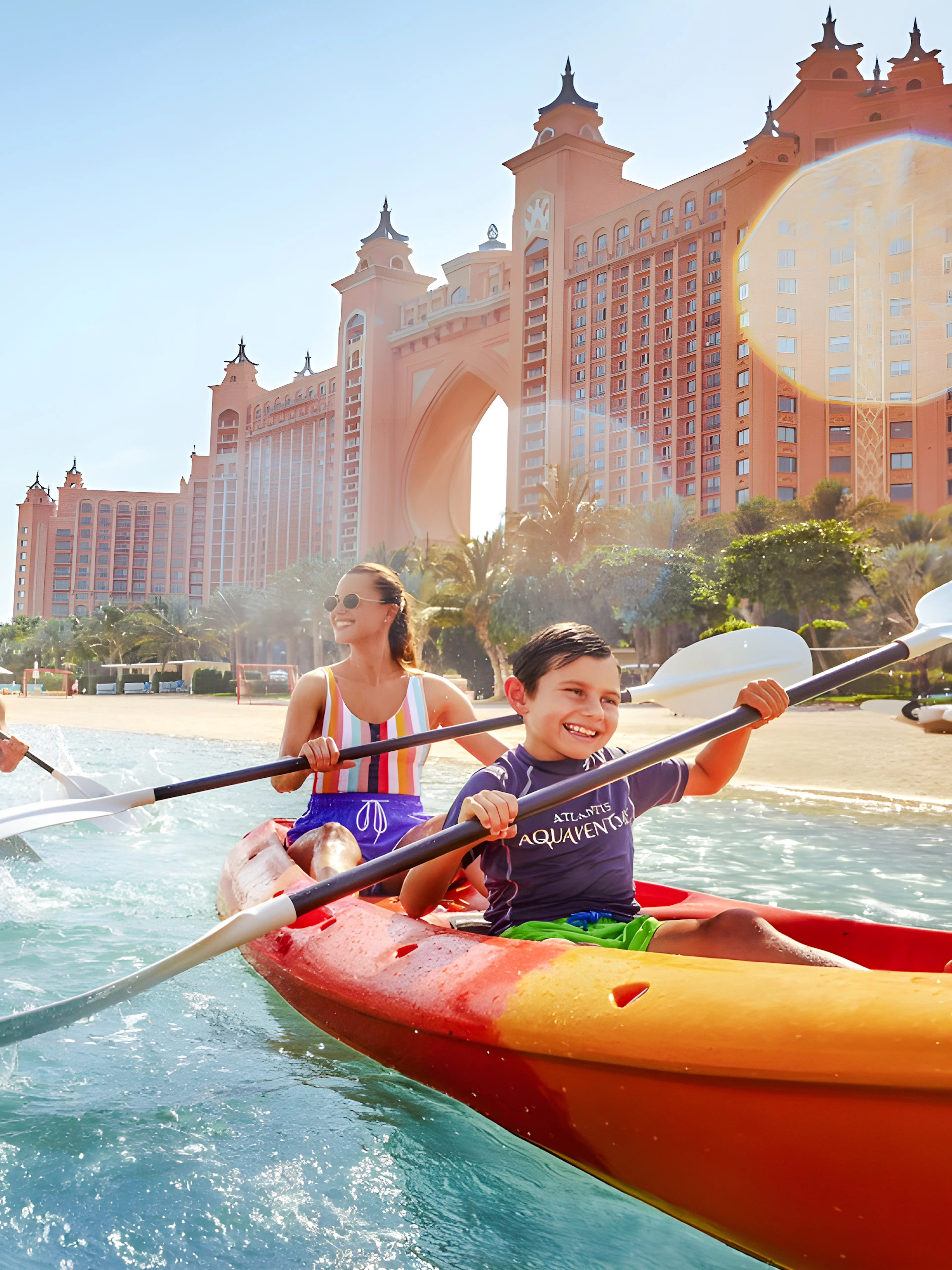 Family kayaking in double kayaks at Atlantis, The Palm, Dubai.