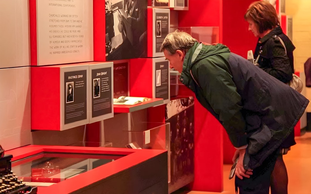 Visitors examining exhibits at Churchill's War Rooms in Westminster.