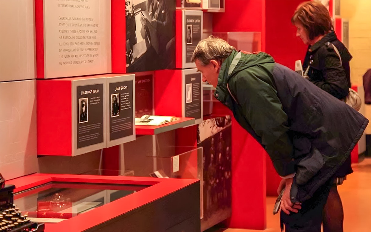Visitors examining exhibits at Churchill's War Rooms in Westminster.