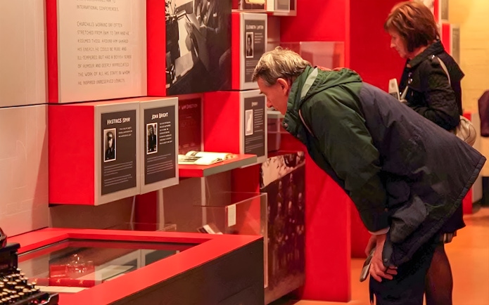 Visitors examining exhibits at Churchill's War Rooms in Westminster.