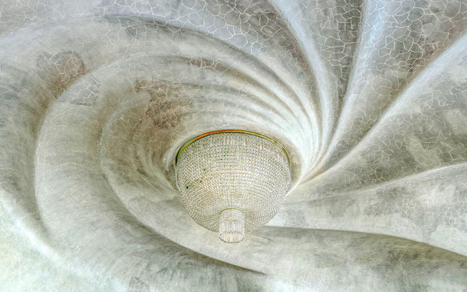 Casa Batlló ceiling with ornate chandelier, Barcelona.