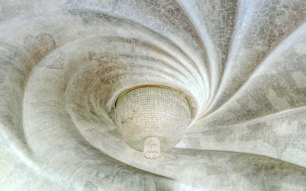 Casa Batlló ceiling with ornate chandelier, Barcelona.