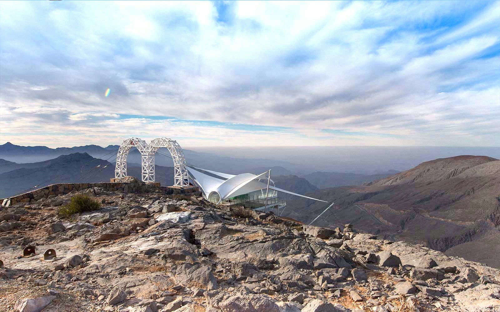 A hiker taking in the view at Jebel Jais