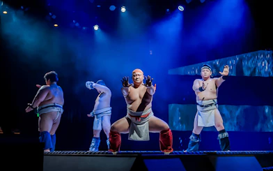 Sumo wrestlers performing at The Sumo Hall Hirakuza in Osaka.