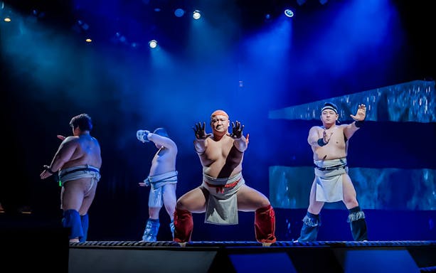 Sumo wrestlers performing at The Sumo Hall Hirakuza in Osaka.