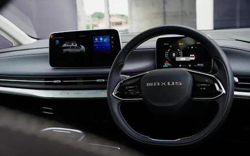 Steering wheel and dashboard of car for Bangkok City Transfer to Suvarnabhumi Airport.