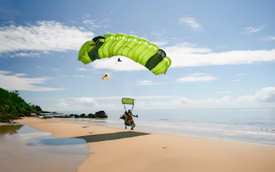 Tandem skydive landing on a beach in Cairns, Australia.