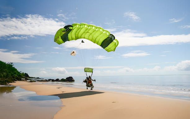 Tandem skydive landing on a beach in Cairns, Australia.