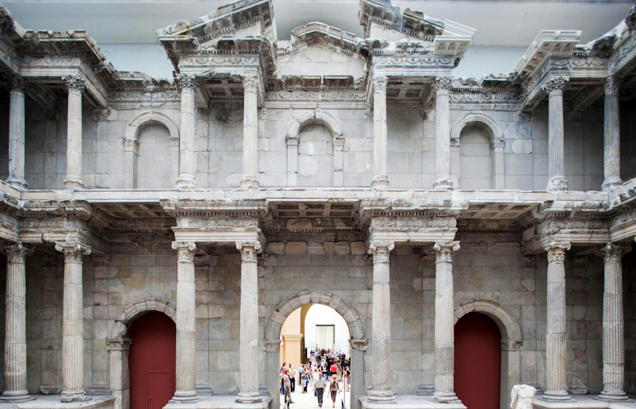 Pergamon Museum's Market Gate of Miletus in Berlin with visitors exploring.