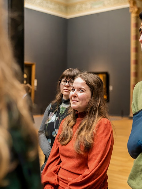 Visitors on a guided tour inside the Rijksmuseum, Amsterdam.