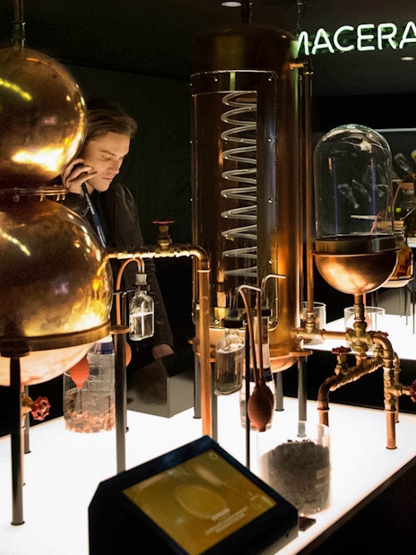 Bols Cocktail Experience interactive exhibit with distillation equipment in Amsterdam.