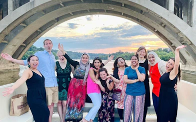 Group enjoying a Washington, DC yacht cruise with city views at sunset.