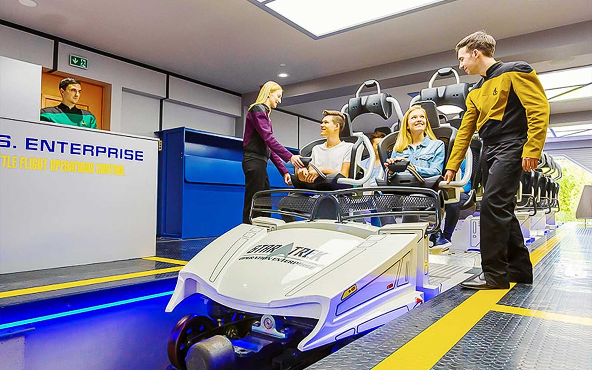 Guests boarding Star Trek: Operation Enterprise ride at Movie Park.