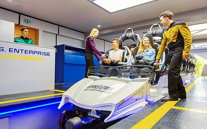 Guests boarding Star Trek: Operation Enterprise ride at Movie Park.