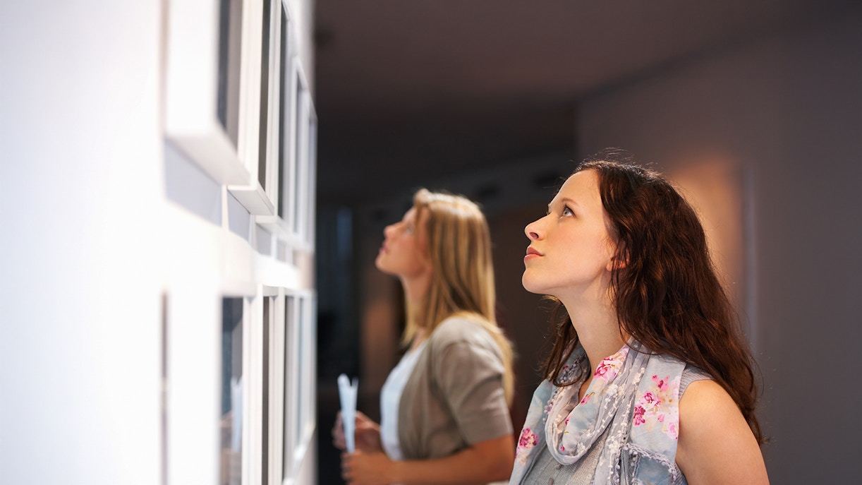 Visitors viewing photographs at the Wildlife Photographer of the Year exhibition.