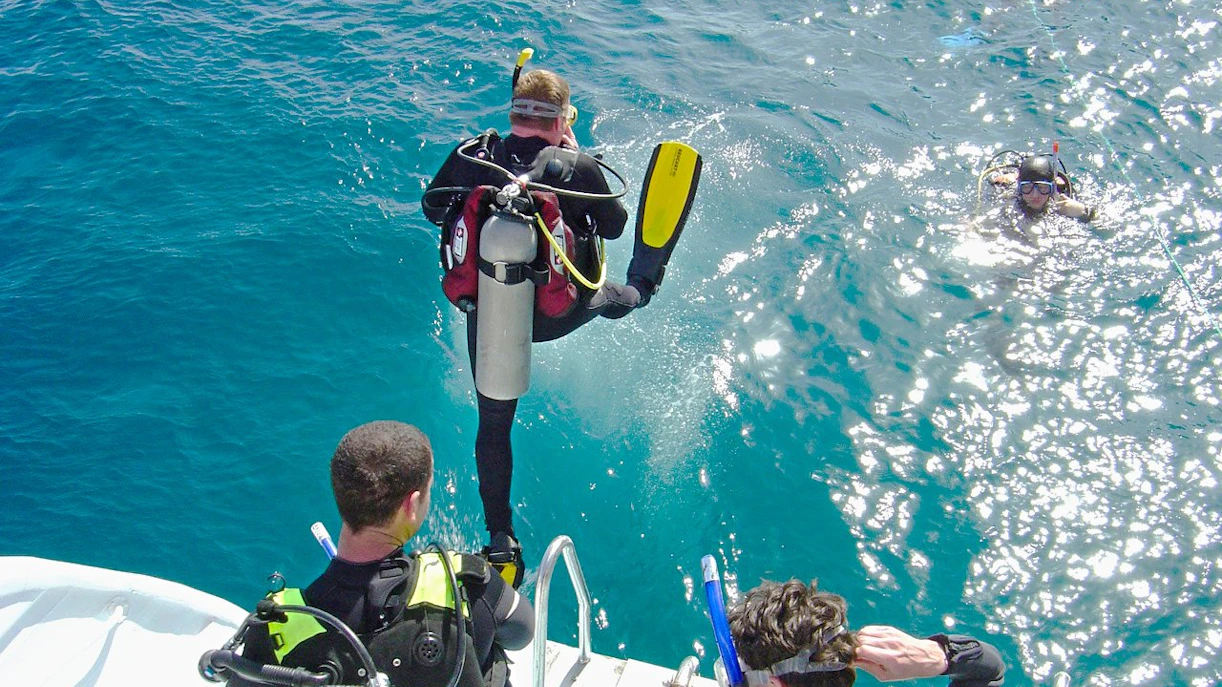 Scuba diver jumping into the Red Sea from a boat, Hurghada.