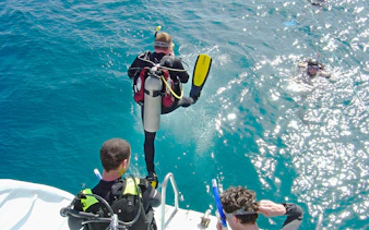Scuba diver jumping into the Red Sea from a boat, Hurghada.