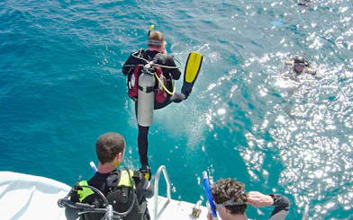 Scuba diver jumping into the Red Sea from a boat, Hurghada.