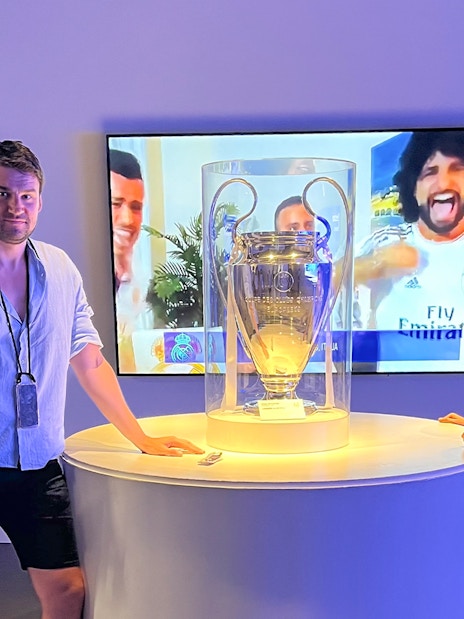 Champions League trophy display at Santiago Bernabeu Stadium.