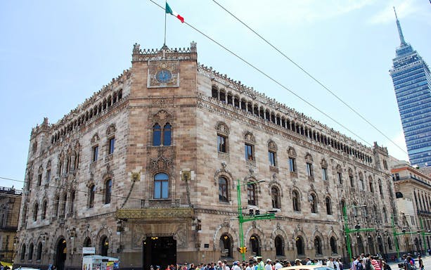 Historic Postal Palace in Mexico City with Torre Latinoamericana in the background.