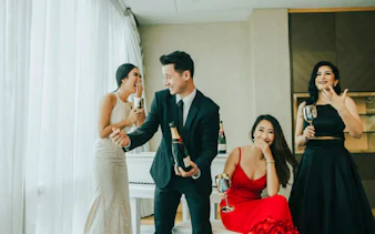Group enjoying a professional photoshoot with champagne in Jakarta.