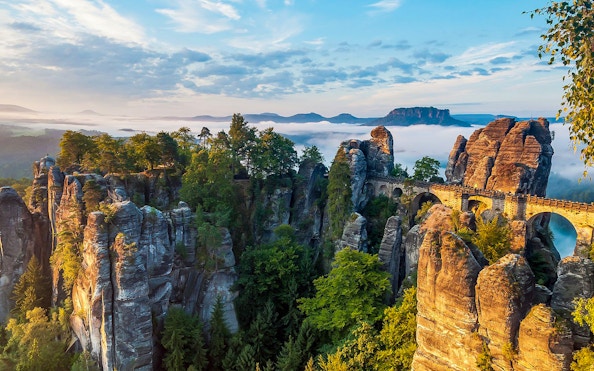 Bastei Bridge spanning rock formations in Saxon Switzerland, Germany, during a guided tour.