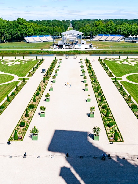 Chambord Castle gardens with symmetrical lawns and decorative patterns, France.