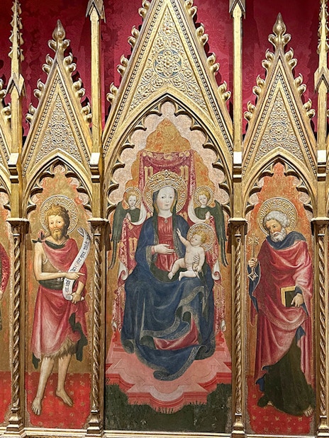 Medieval religious artwork inside Castel Sant'Angelo, Rome, depicting saints and Madonna.