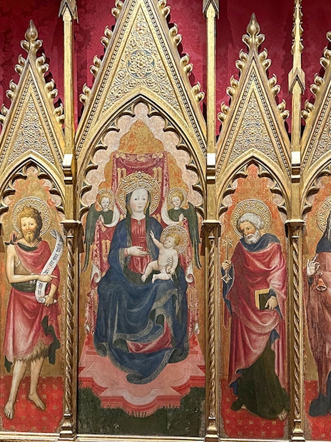 Medieval religious artwork inside Castel Sant'Angelo, Rome, depicting saints and Madonna.