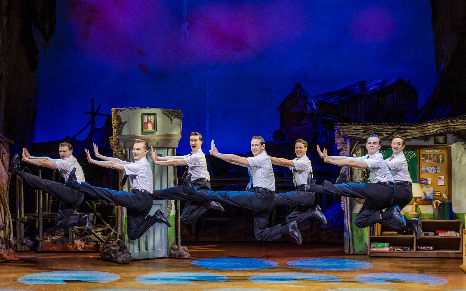 Performers leaping on stage during The Book of Mormon in Brisbane.