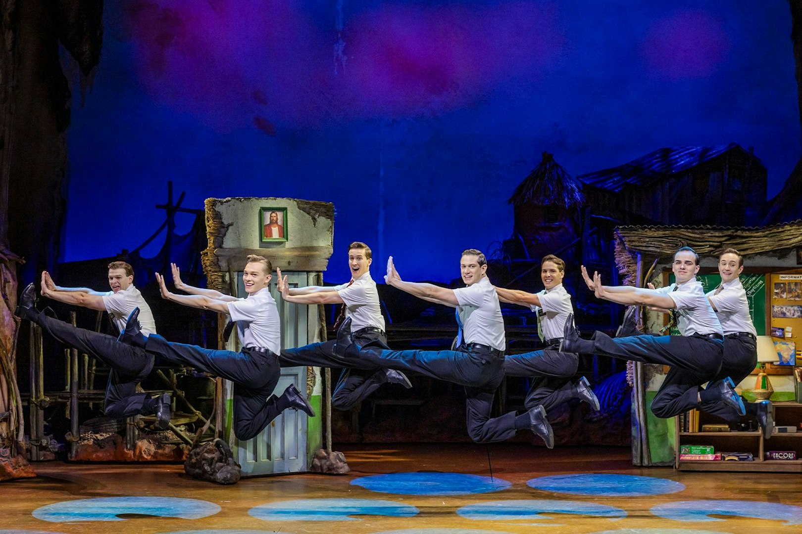 Performers leaping on stage during The Book of Mormon in Brisbane.