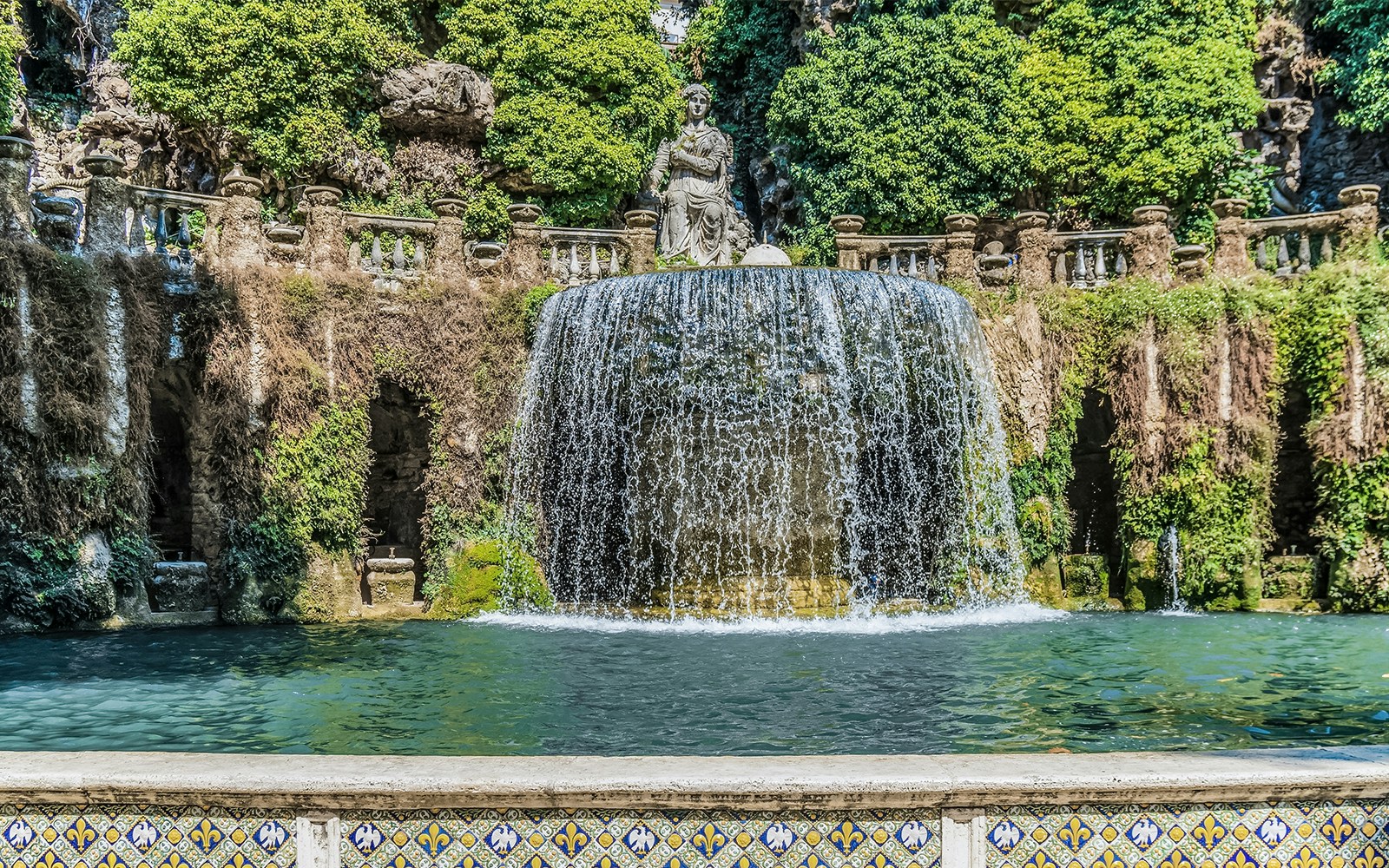 Fountain of the Oval at Villa d'Este, Tivoli, Italy, with cascading water and lush gardens.