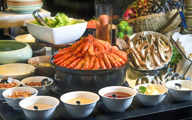 Seafood buffet with prawns, oysters, and sauces at Le Méridien Petaling Jaya.