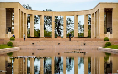 Normandy American Cemetery memorial with reflecting pool on D-Day beaches day trip.