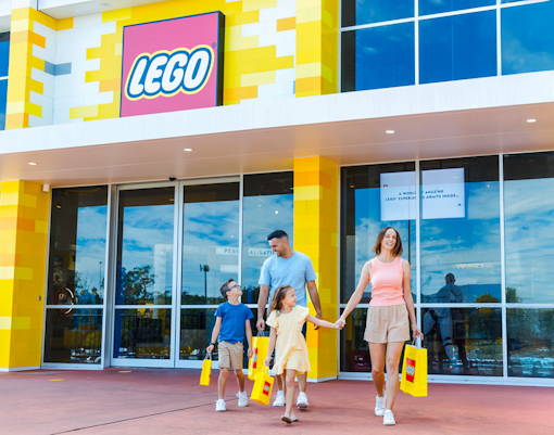 Family exploring Lego store at Dreamworld, Gold Coast.