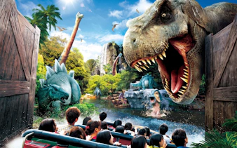 Visitors on a boat ride encounter dinosaurs at Jurassic Park: The Ride, Universal Studios Japan.