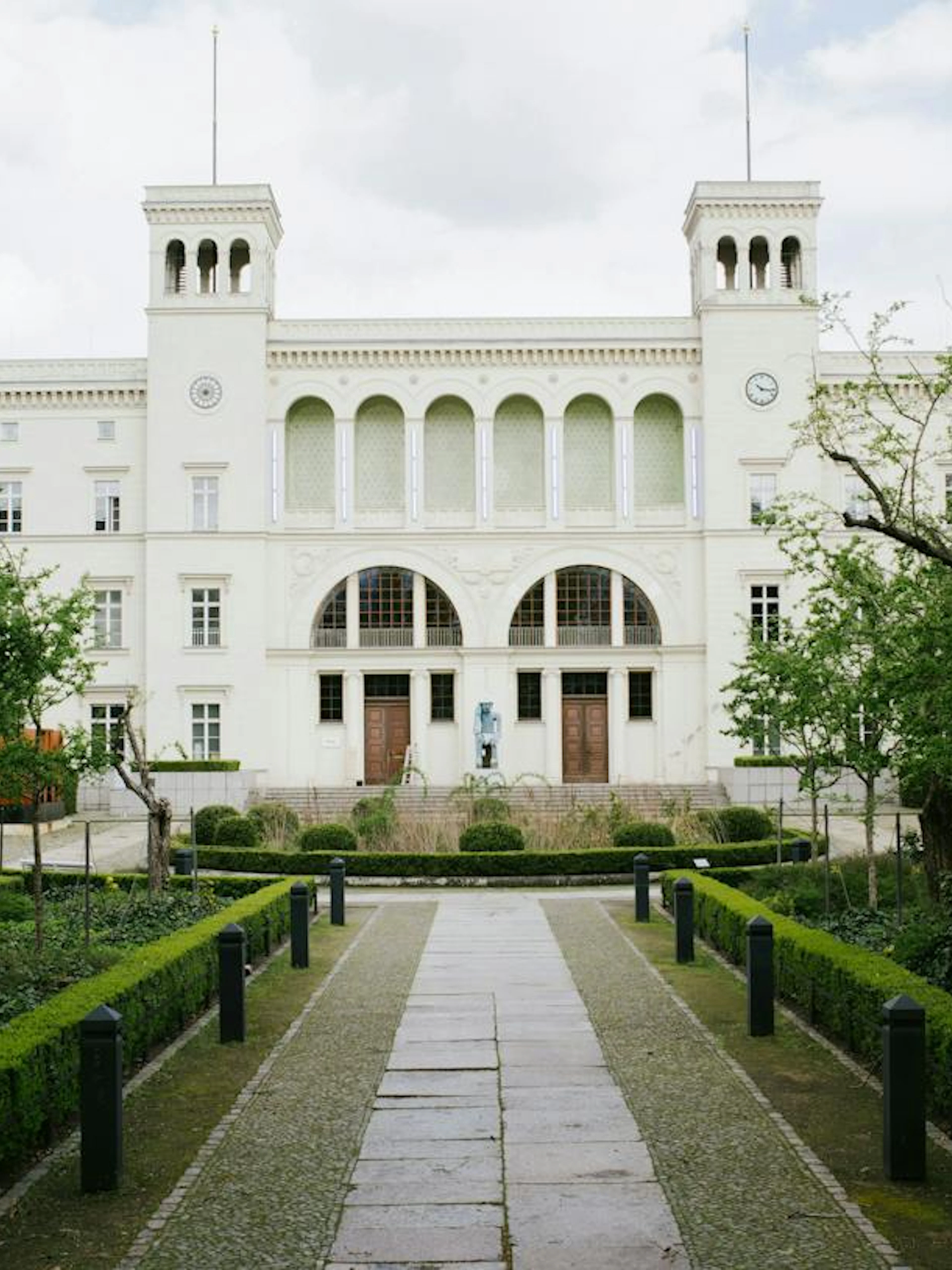 Berlin museum with garden path, part of Secrets of Berlin Spy Mission game.