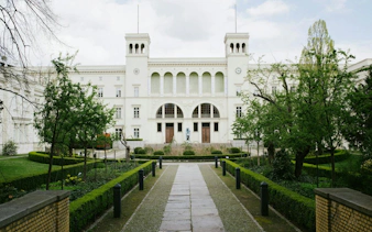 Berlin museum with garden path, part of Secrets of Berlin Spy Mission game.