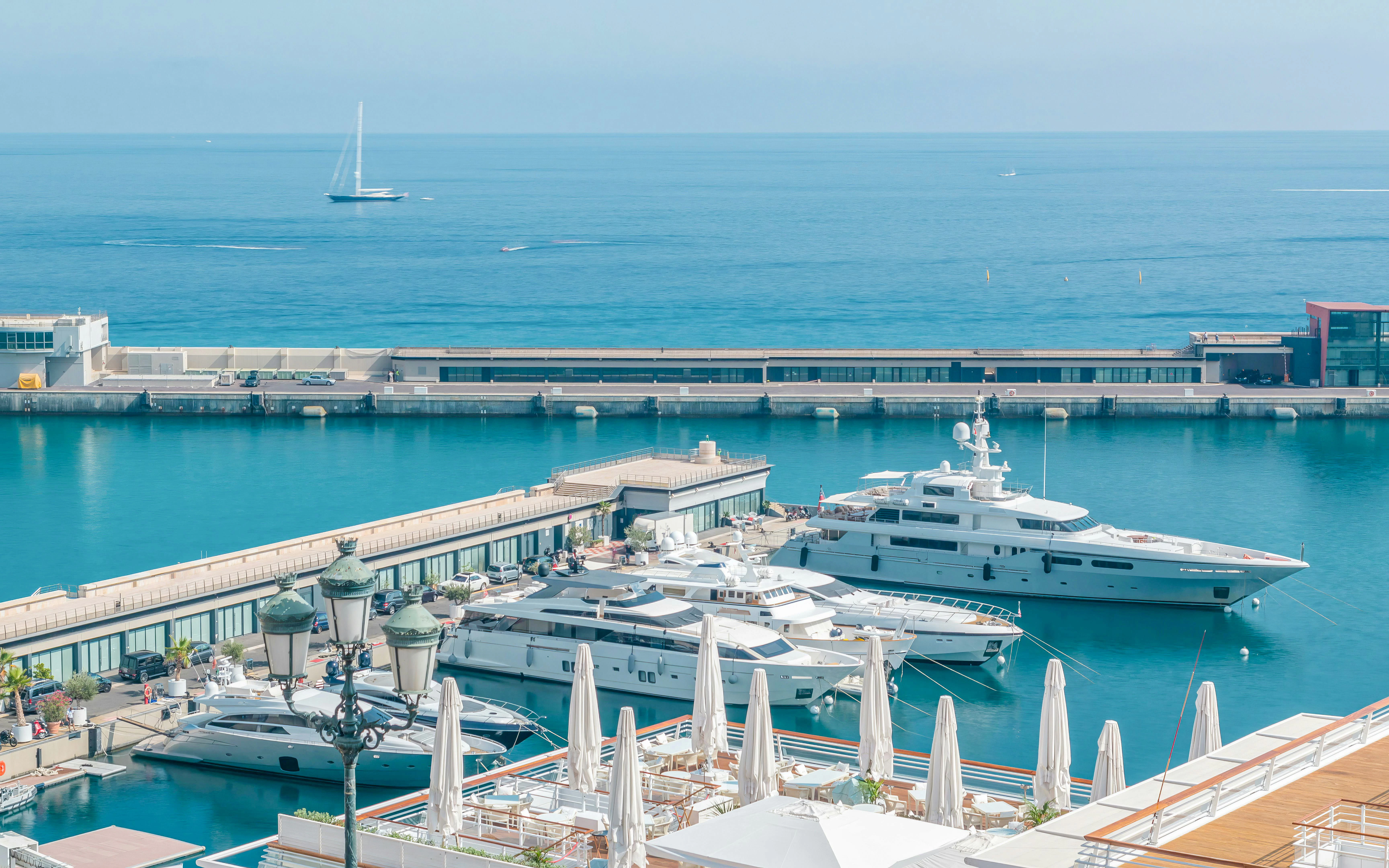 Boats docked at Monaco Yacht Club with Mediterranean Sea view in Monte Carlo, Monaco.