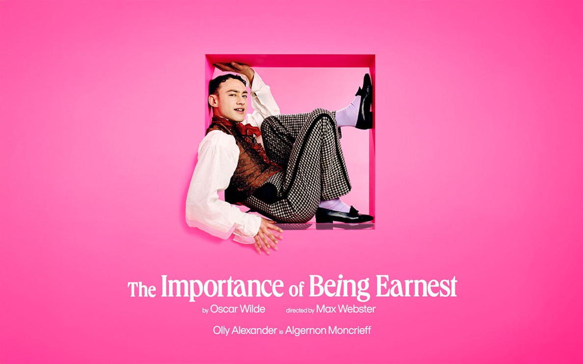 Theater stage with actors performing "The Importance of Being Earnest" in London.