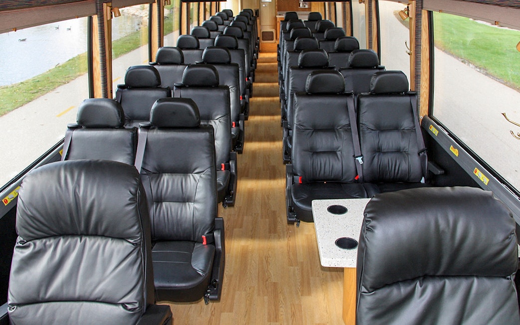 Luxury bus interior with leather seats for Couch USA route from Newark Airport to Manhattan.