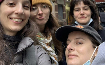 Group exploring New York City streets on a self-guided mob history tour.